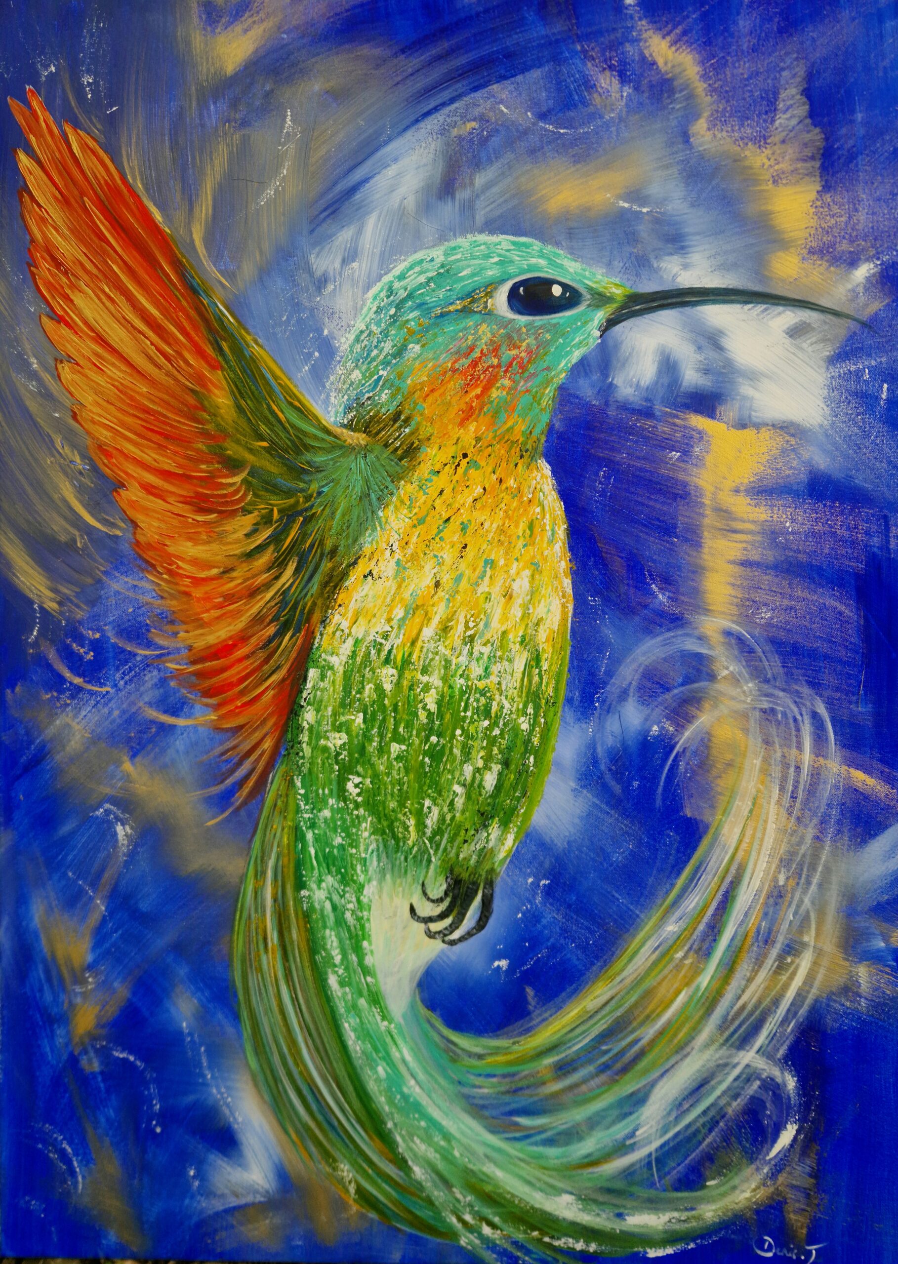 Colibri multicolore sur fond bleu